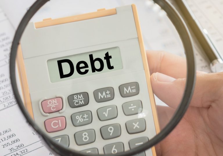 Debt being shown on a calculator