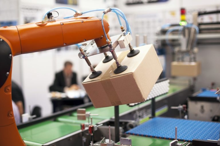 Robotic arm holding a box package