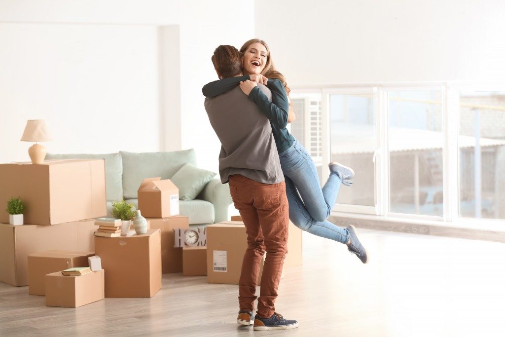 couple hugging each other, moving to new home
