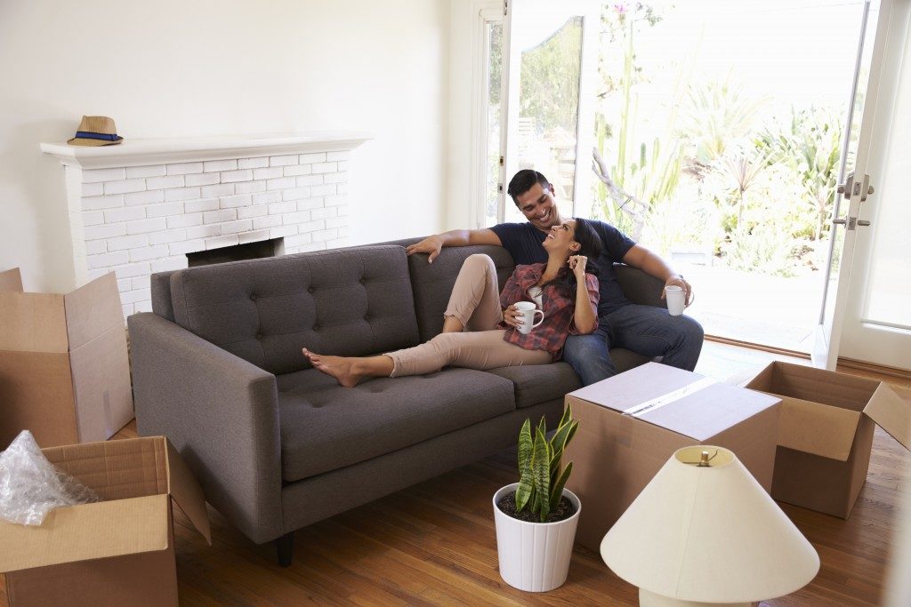Couple on the couch after moving into new home