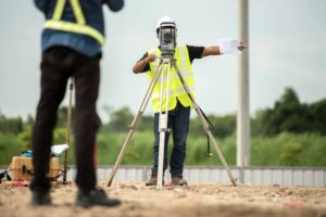 men land surveying
