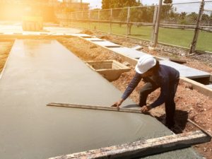 man smoothing out concrete