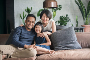 Asian family sitting in the living room