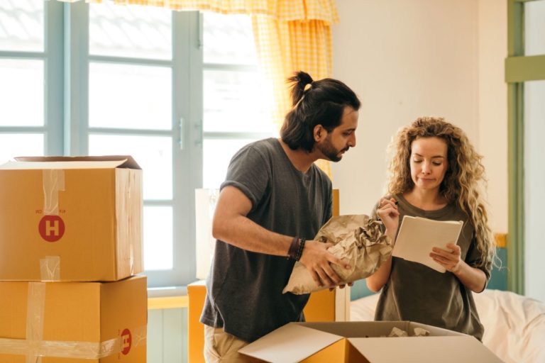 couple checking items while unpacking