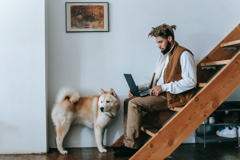 man working from home with his dog