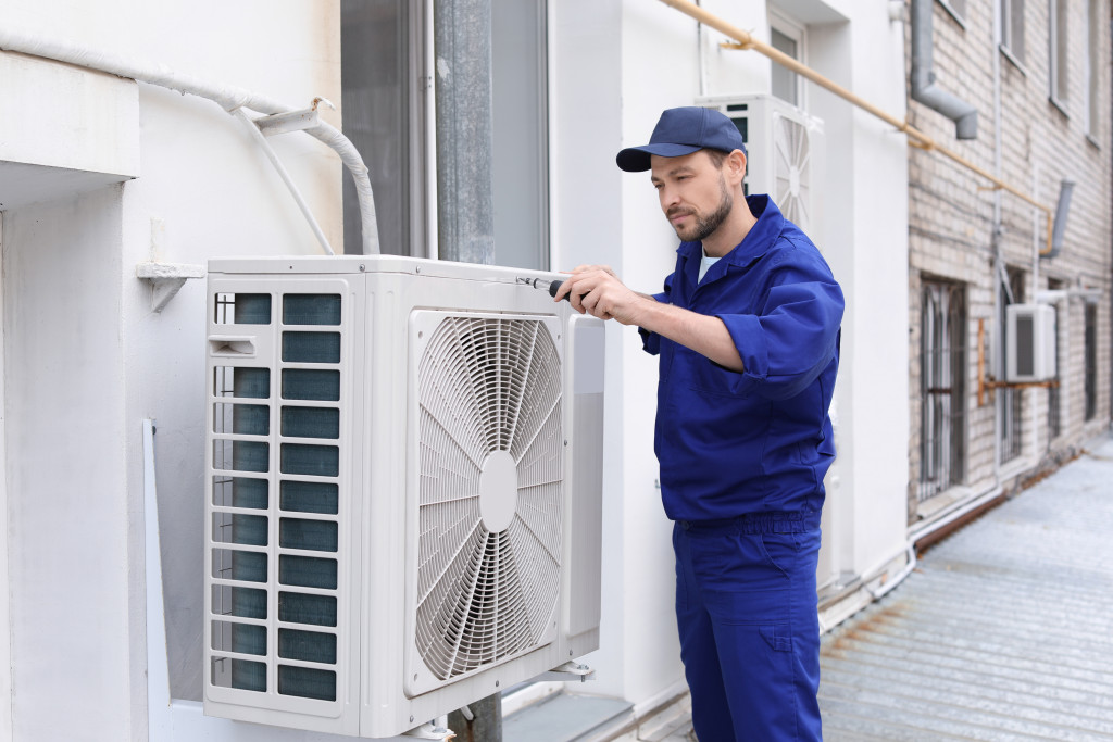 man installing air-conditioning unit