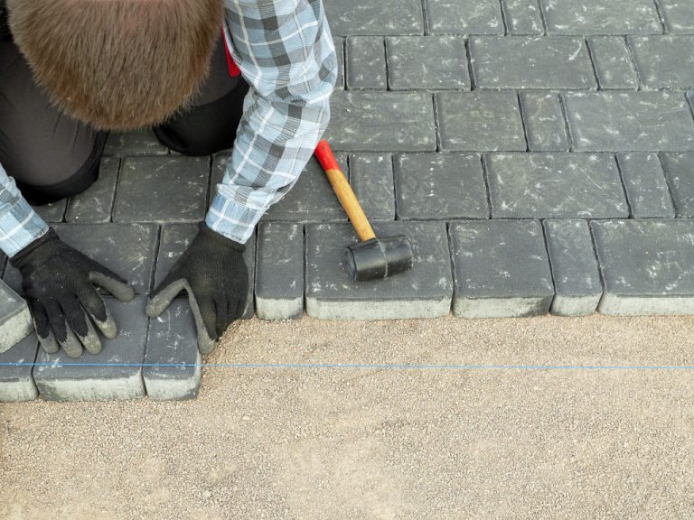 person fixing flooring