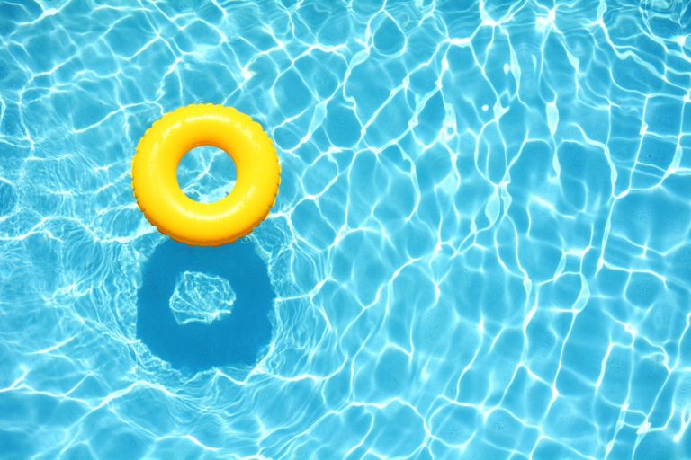 Yellow pool float in pool
