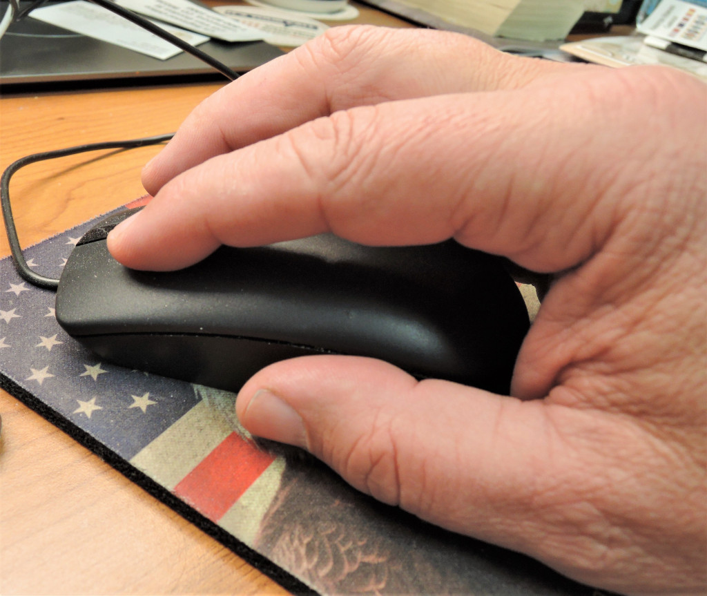 man using a computer mouse