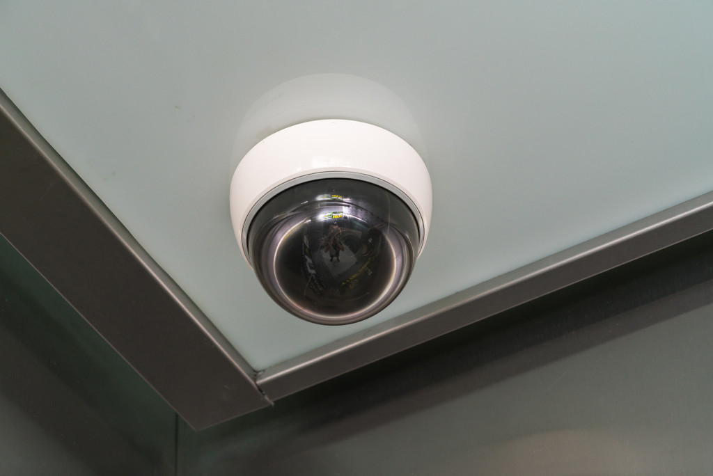 A security camera installed near a corner of a room