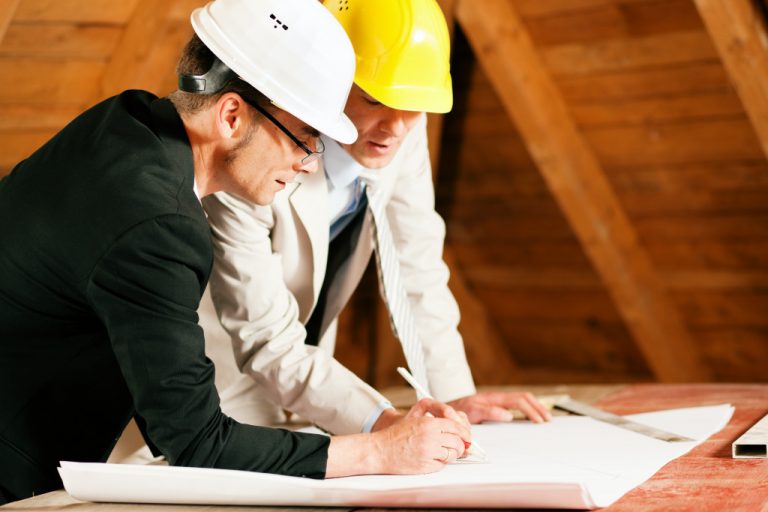 two contractors working on a house plan