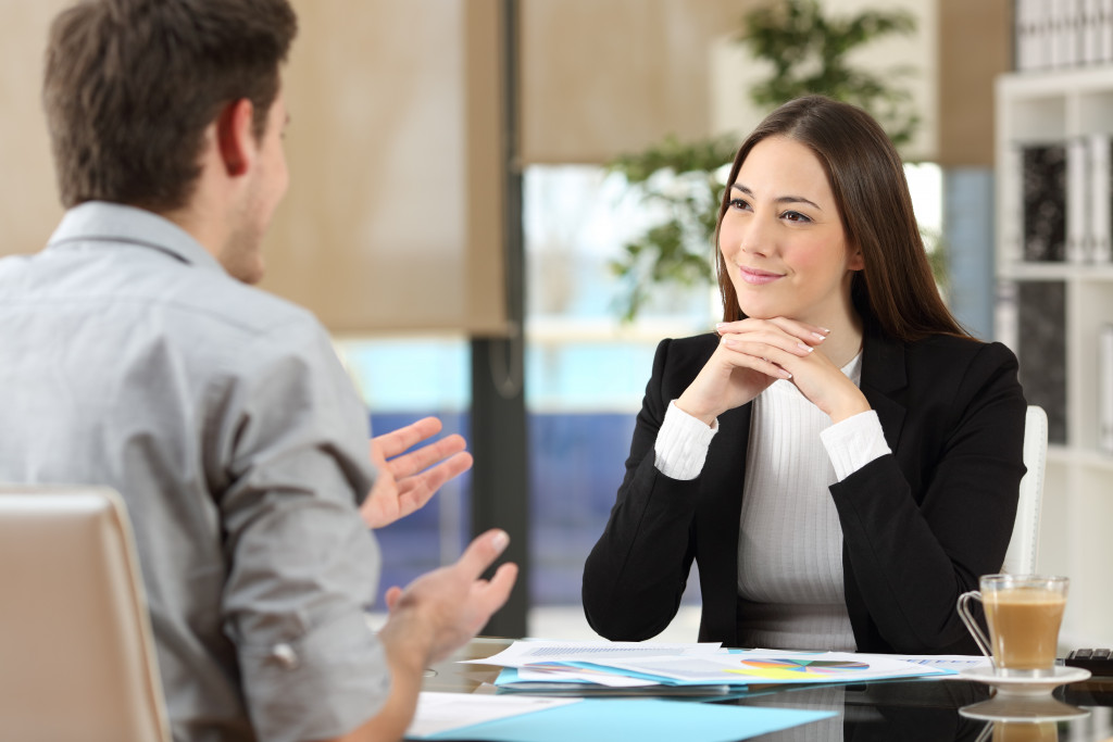 businesswoman listening to client or employee