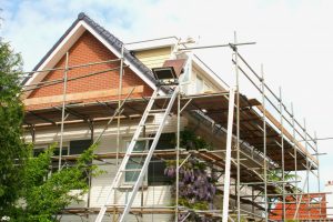 a house surrounded by scaffoldings