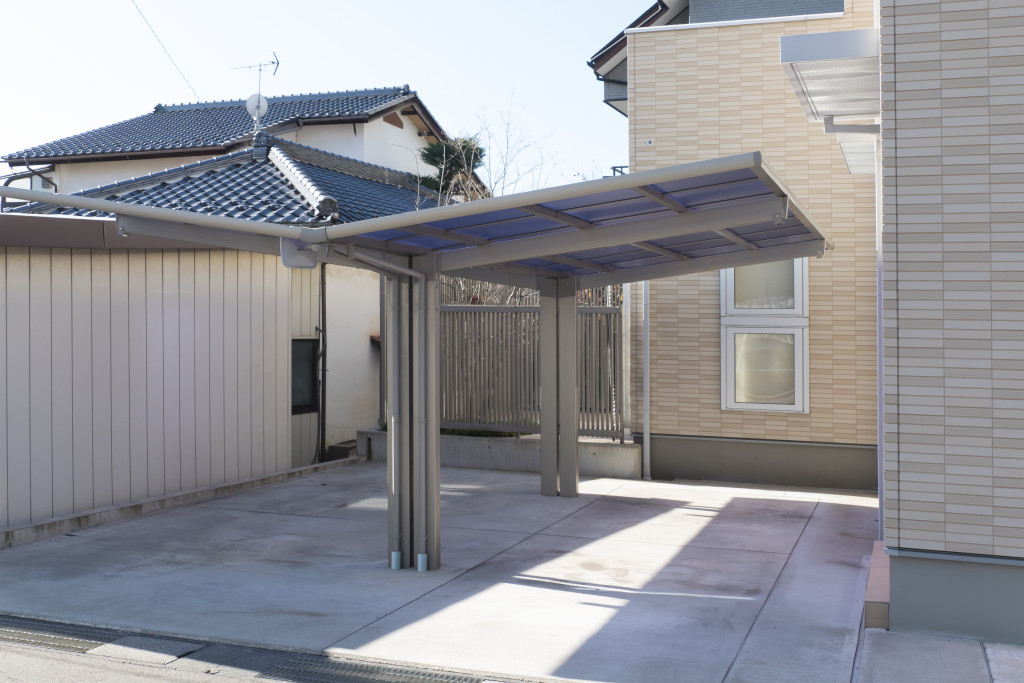 A carport installed on the side of a house