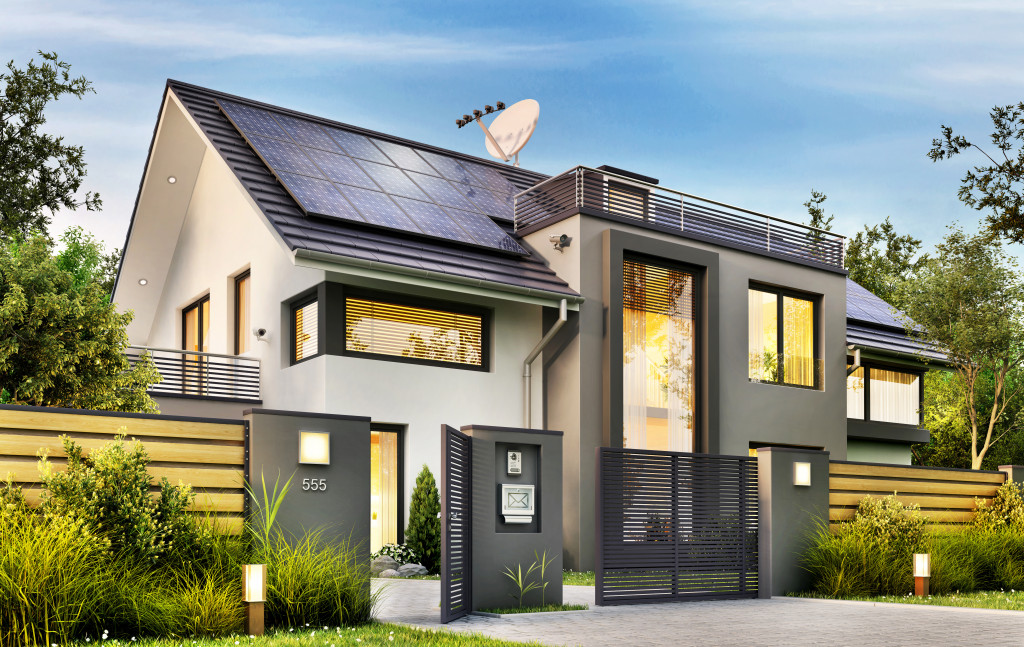 A modern house with solar panels installed at the top of the roof