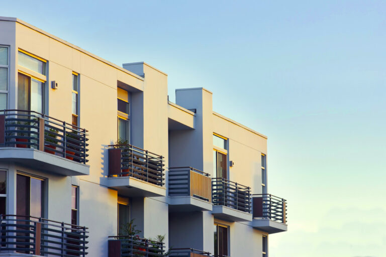 An image of apartment balconies at sunset