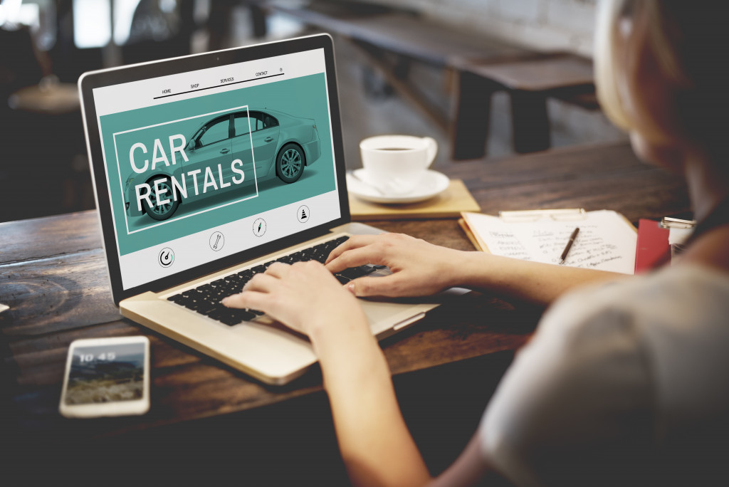 woman posting car rental ads online