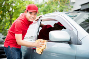 man cleaning the car