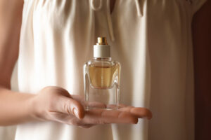woman holding a perfume