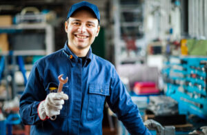 auto mechanic holding a repair tool