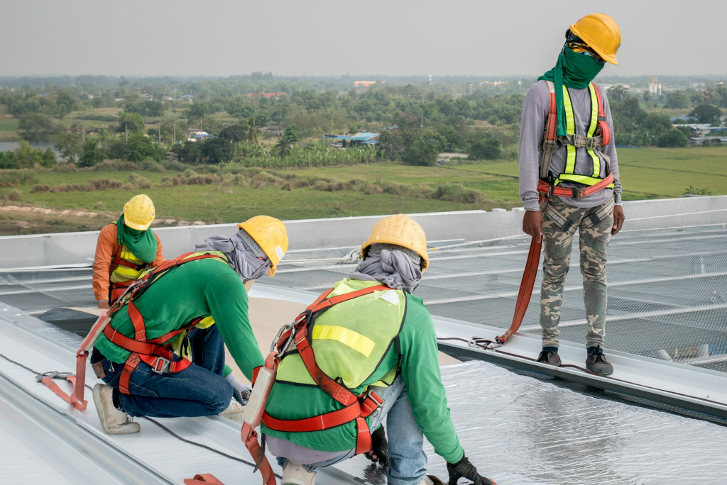 Workers repairing a commercial roof