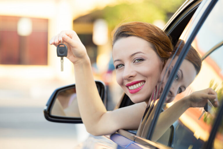 female car owner holding keys