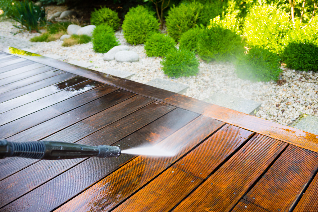 power washing the wooden patio