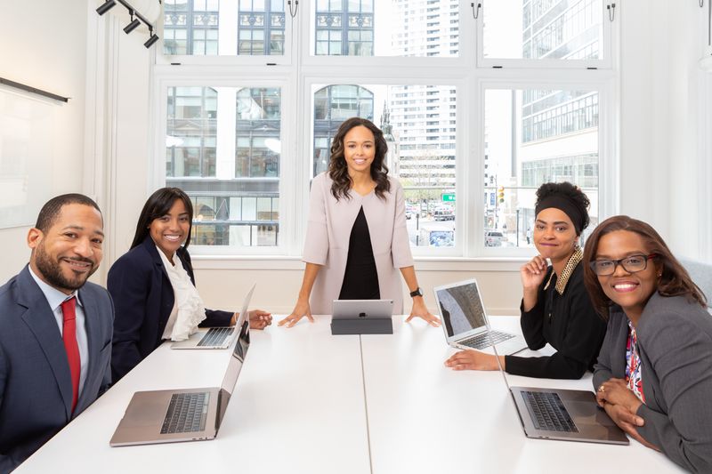 a business leader and her team